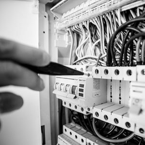 Electrician working on a fuse box