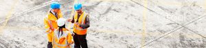 People in Hi-vis and hard hats having a discussion