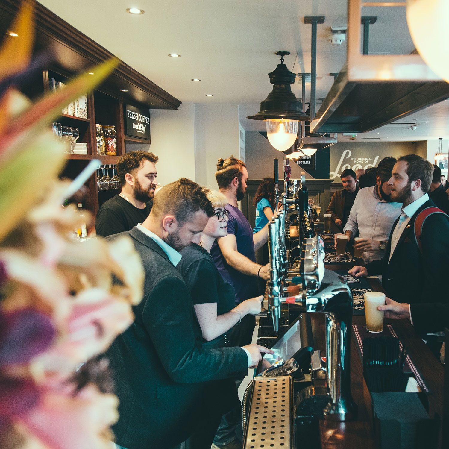 Image of people at the bar in Leeds brewery Tap